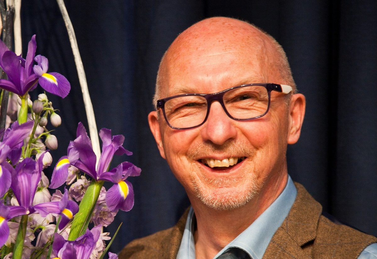 Craig Bullock and a floral display